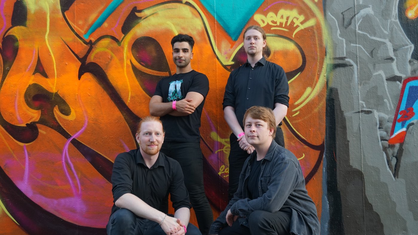 Tidestone band press photo in front of colorful graffiti